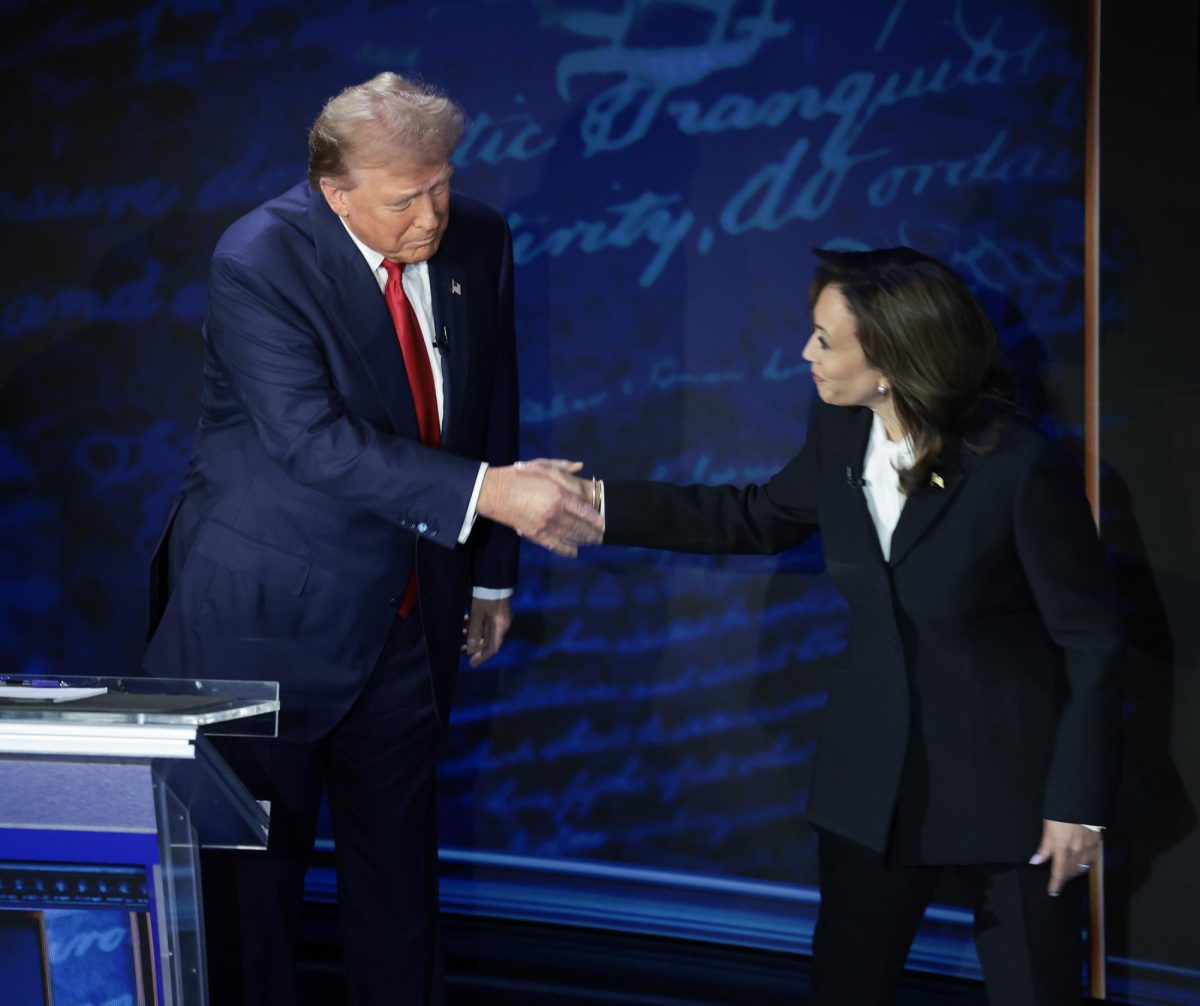 Former U.S. President Donald Trump and Current U.S. Vice President shaking hands as they commence their first presidential debate Tuesday night in Philadelphia, Pennsylvania.