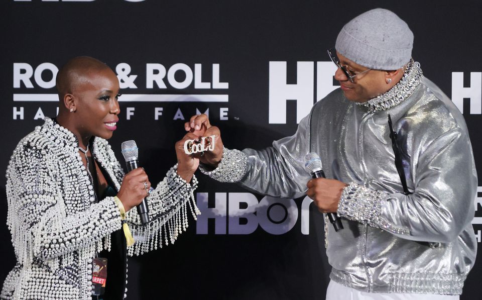 Rock &amp; Roll Hall of Fame Chief Curator Nwaka Onwusa (L) receives Rock and Roll Hall of Fame inductee LL Cool Js diamond studded knuckle bling after his induction.  Onwusa recently left the Rock Hall to become the creative director at the Universal Hip Hop Museum in the Bronx. John Kuntz, cleveland.com