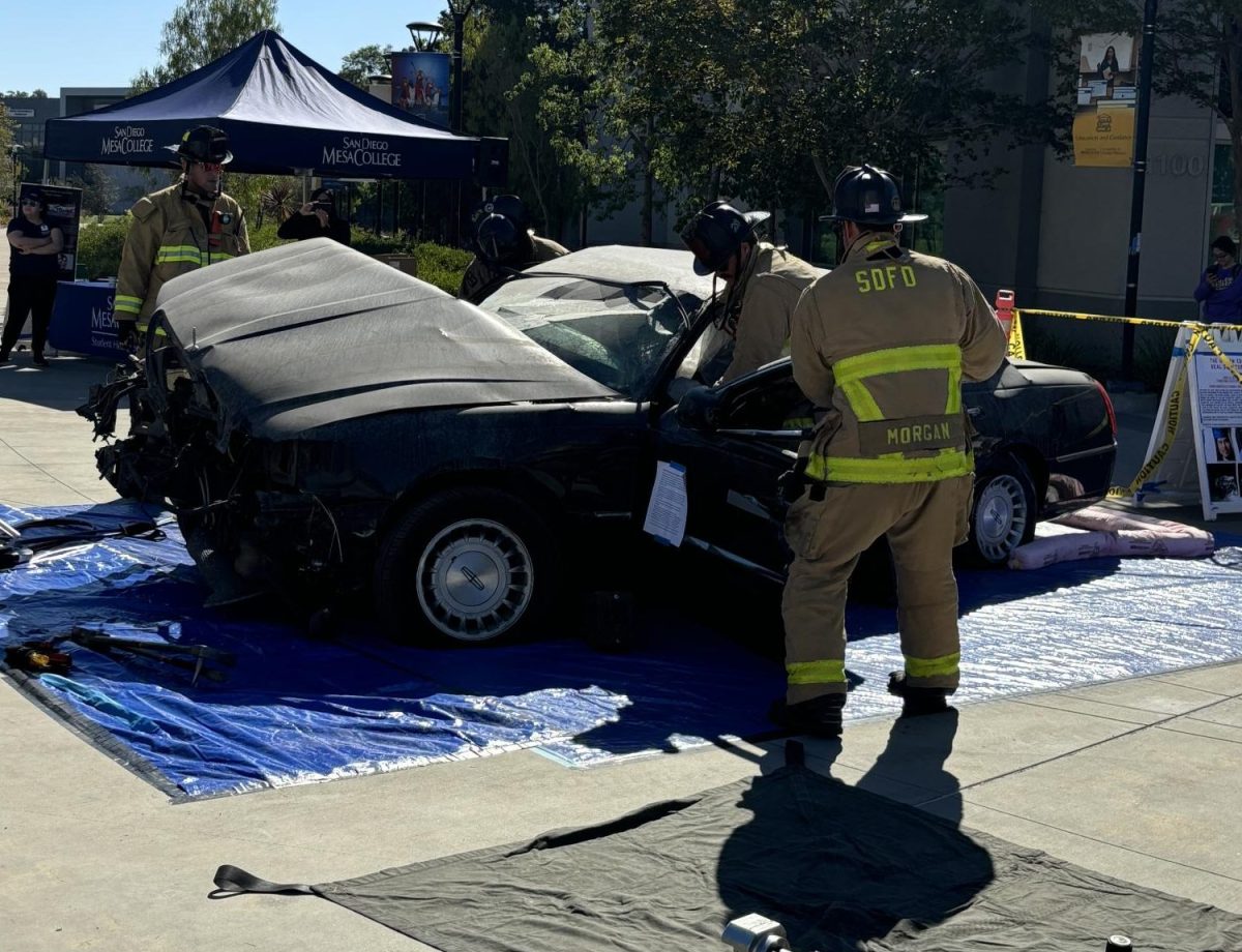 Firefighters demonstrate the Jaws of Life during a simulated car accident at the Death Experience event on Oct. 23.