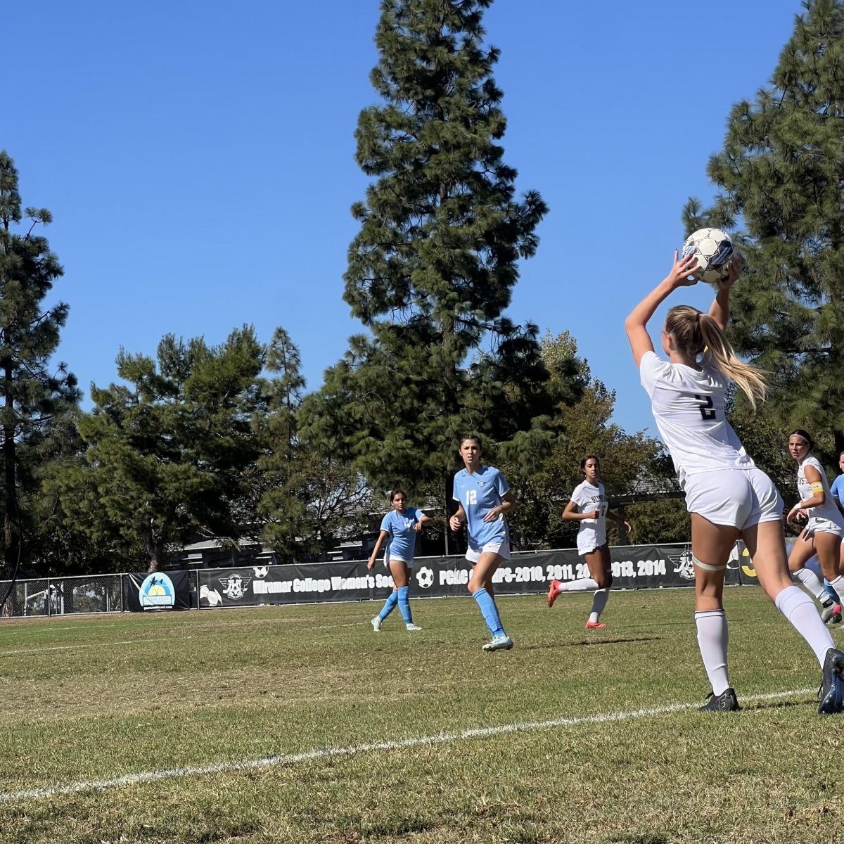 Mesa forward Madilyn Grace Mayo completes a throw-in.