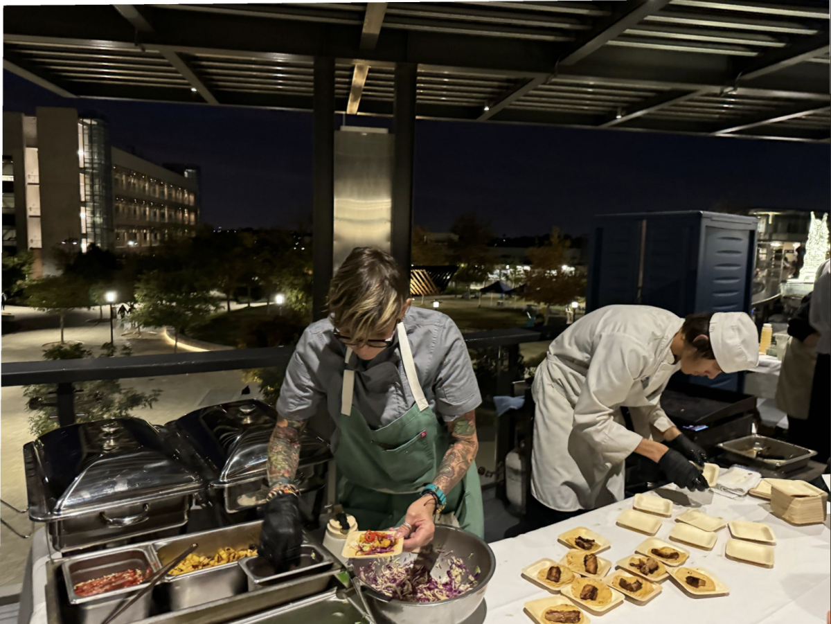 Alumna chef Keely Shawn serving up her signature dish, pork belly street tacos. 