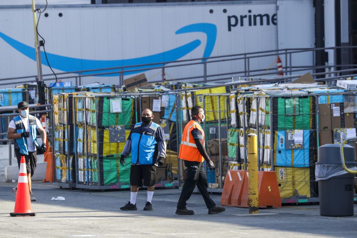 HAWTHORNE, CA - MAY 01: Delivery vans leave Amazon warehouse facility in Hawthorne. Hawthorne, CA. (Irfan Khan / Los Angeles Times)