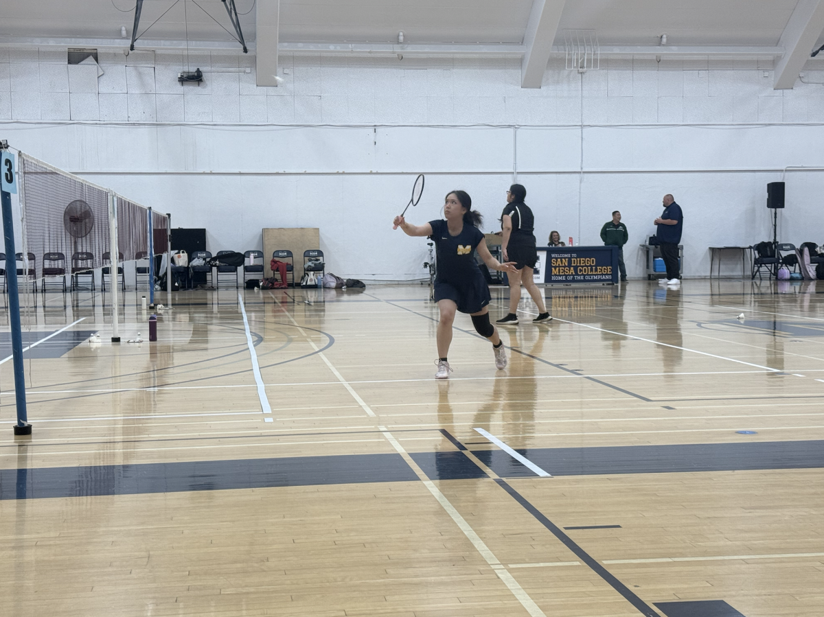 Mesa women's badminton player lunges for a return against East Los Angeles.